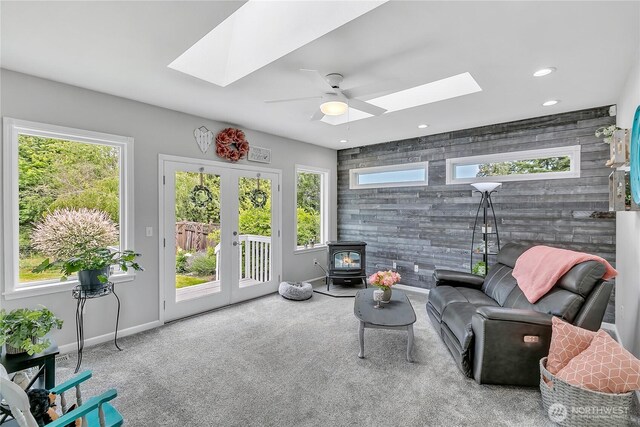 1317 23rd Ave SW, Puyallup, WA 98371 - sitting room with a skylight, a wood stove, ceiling fan, plenty of natural light, and recessed lighting
