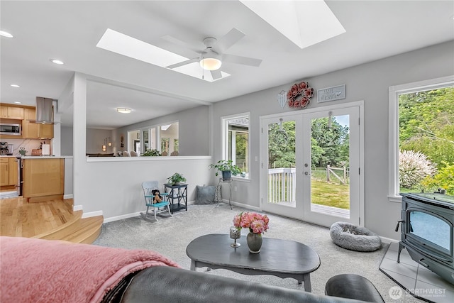 1317 23rd Ave SW, Puyallup, WA 98371 - living area featuring a skylight, french doors, recessed lighting, and a ceiling fan