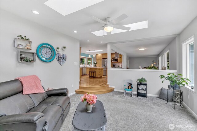 1317 23rd Ave SW, Puyallup, WA 98371 - living area featuring a skylight, light carpet, ceiling fan, and recessed lighting