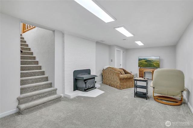 1317 23rd Ave SW, Puyallup, WA 98371 - sitting room with a wood stove, stairway, and carpet flooring