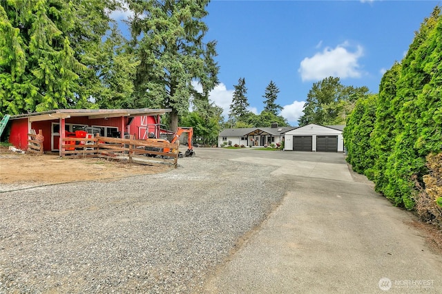 1317 23rd Ave SW, Puyallup, WA 98371 - view of front of property featuring a detached garage and an outdoor structure
