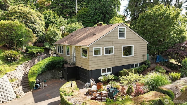 456 Upper Grand Ave, Hoquiam, WA 98550 - view of front of home with driveway and roof with shingles