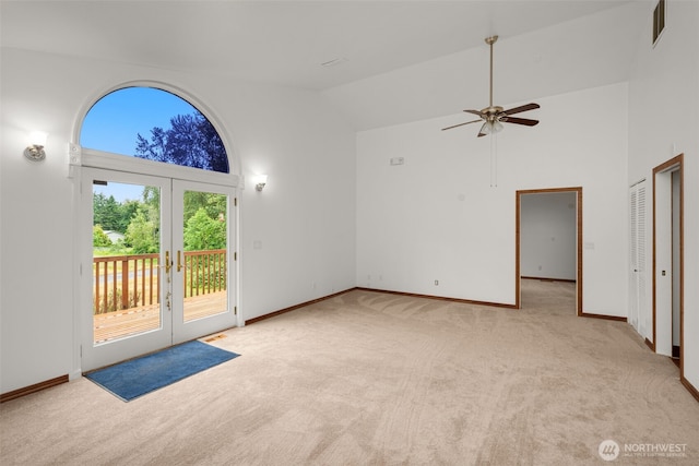 28713 207th Ave SE, Kent, WA 98042 - unfurnished living room with carpet flooring, ceiling fan, french doors, and high vaulted ceiling