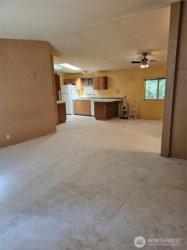61 Flamingo Rd, Port Townsend, WA 98368 - unfurnished living room featuring concrete flooring and ceiling fan