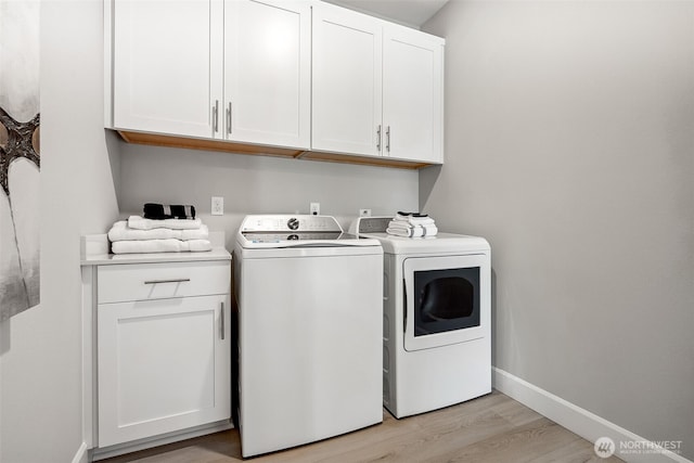 20230 150th St E Unit 598, Bonney Lake, WA 98391 - laundry area with washing machine and clothes dryer, cabinet space, and light wood-type flooring