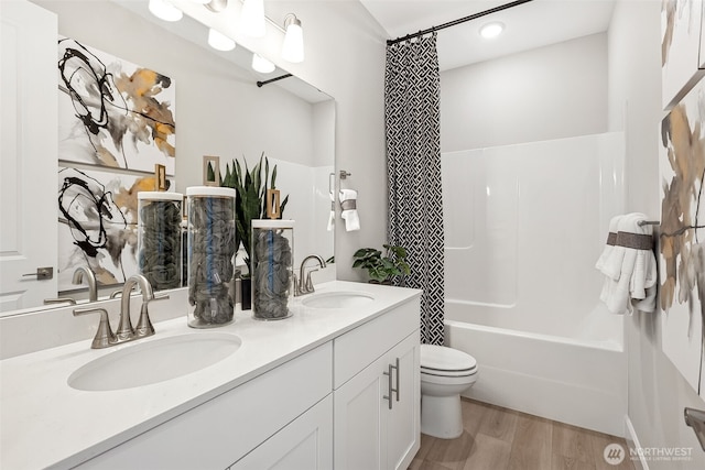 20230 150th St E Unit 598, Bonney Lake, WA 98391 - bathroom with double vanity, shower / bath combo with shower curtain, and wood finished floors