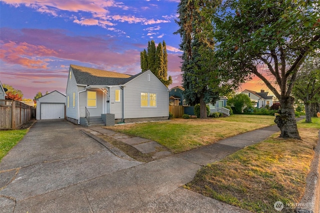 2849 Flordia St, Longview, WA 98632 - view of front of home with an outdoor structure, a detached garage, and asphalt driveway