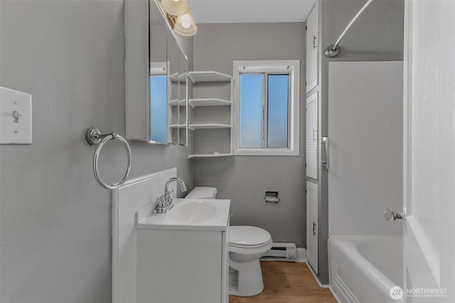 2849 Flordia St, Longview, WA 98632 - bathroom featuring a baseboard heating unit, vanity, and wood finished floors