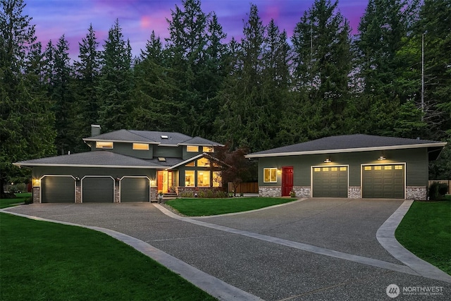 44422 SE 130th St, North Bend, WA 98045 - view of front of property featuring a front yard, asphalt driveway, and stone siding