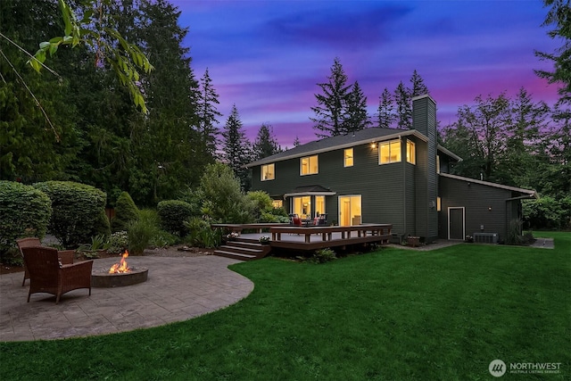 44422 SE 130th St, North Bend, WA 98045 - back of house with a fire pit, a patio area, a chimney, a yard, and a deck