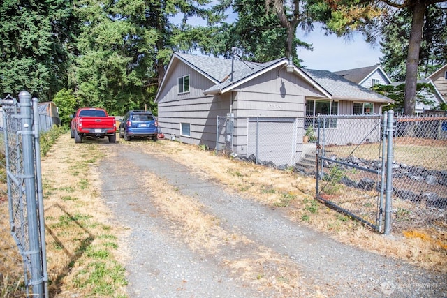 13814 C St S, Tacoma, WA 98444 - view of front of home with driveway, a gate, and a shingled roof