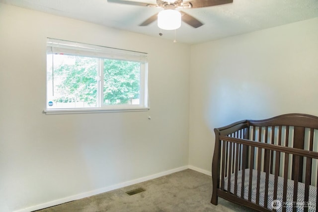 13814 C St S, Tacoma, WA 98444 - unfurnished bedroom with carpet flooring, a nursery area, and a ceiling fan