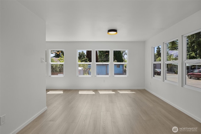 24222 54th Ave W Unit 55, Mountlake Terrace, WA 98043 - unfurnished room with light wood-style flooring and baseboards