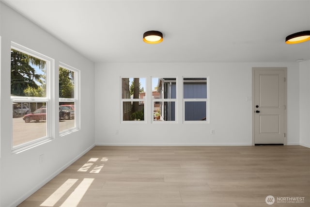24222 54th Ave W Unit 55, Mountlake Terrace, WA 98043 - spare room featuring light wood finished floors and baseboards