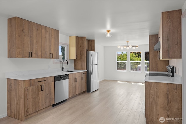 24222 54th Ave W Unit 55, Mountlake Terrace, WA 98043 - kitchen with stainless steel appliances, light wood-type flooring, and light countertops