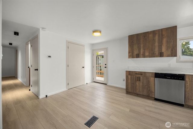 24222 54th Ave W Unit 55, Mountlake Terrace, WA 98043 - kitchen featuring dishwasher, light countertops, light wood finished floors, and modern cabinets