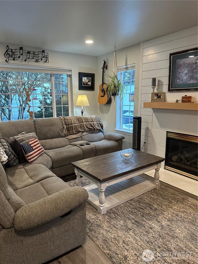 314 Birchwood Ln, Sedro Woolley, WA 98284 - living area with wood finished floors, a tile fireplace, and recessed lighting