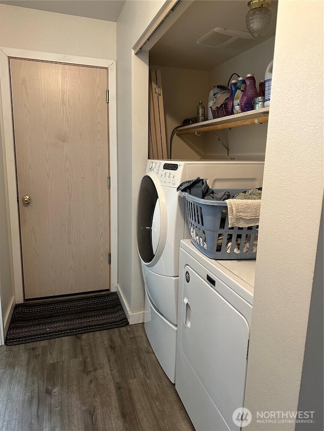 314 Birchwood Ln, Sedro Woolley, WA 98284 - laundry area featuring washing machine and dryer and dark wood-type flooring