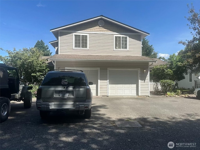 314 Birchwood Ln, Sedro Woolley, WA 98284 - view of front facade featuring an attached garage, driveway, and roof with shingles