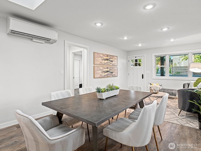 4853 42nd Ave SW, Seattle, WA 98116 - dining area with a wall mounted air conditioner, recessed lighting, and wood finished floors