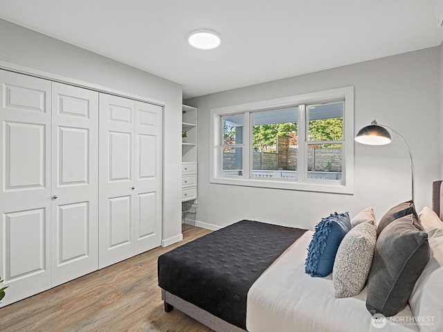 4853 42nd Ave SW, Seattle, WA 98116 - bedroom with light wood-style flooring and a closet