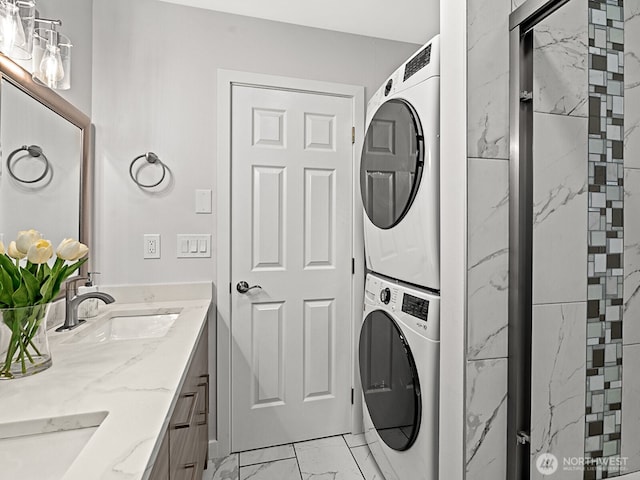 4853 42nd Ave SW, Seattle, WA 98116 - laundry room with estacked washer and dryer and light marble finish floors