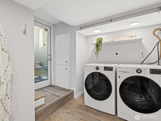 4853 42nd Ave SW, Seattle, WA 98116 - washroom with washer and clothes dryer and wood finished floors
