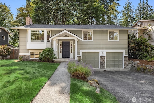10733 126th Pl NE, Kirkland, WA 98033 - bi-level home featuring stone siding, asphalt driveway, a garage, and a chimney