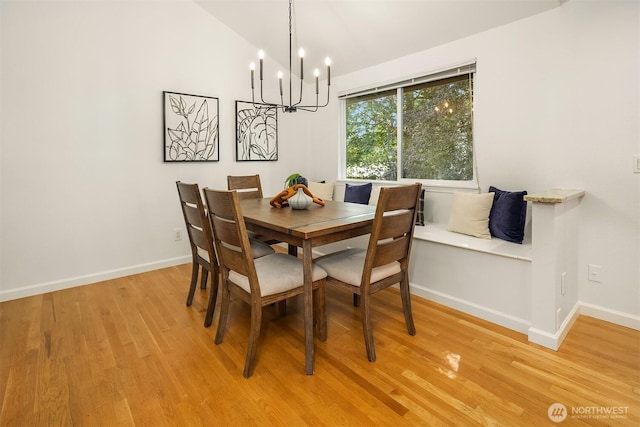 10733 126th Pl NE, Kirkland, WA 98033 - dining area with light wood-style flooring, a chandelier, and vaulted ceiling