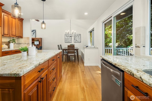 10733 126th Pl NE, Kirkland, WA 98033 - kitchen featuring stainless steel dishwasher, light wood-style flooring, tasteful backsplash, a chandelier, and brown cabinets