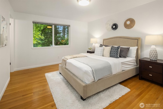 10733 126th Pl NE, Kirkland, WA 98033 - bedroom with light wood-style floors and baseboards