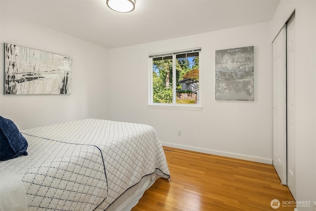 10733 126th Pl NE, Kirkland, WA 98033 - bedroom featuring wood finished floors and a closet