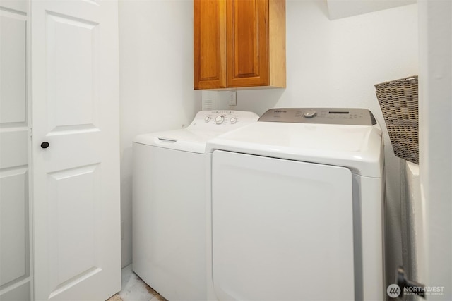 10733 126th Pl NE, Kirkland, WA 98033 - washroom with cabinet space and washer and dryer
