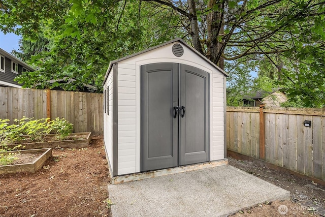 10733 126th Pl NE, Kirkland, WA 98033 - view of shed featuring a garden and a fenced backyard