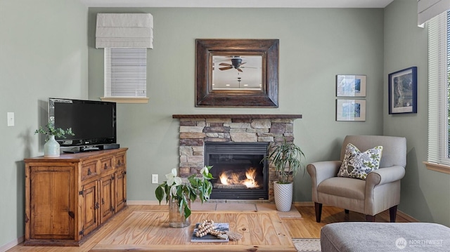 4422 NE 2nd Ln, Renton, WA 98059 - living room with wood finished floors, a fireplace, and healthy amount of natural light