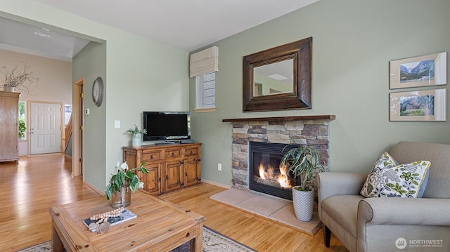 4422 NE 2nd Ln, Renton, WA 98059 - living room featuring light wood finished floors and a fireplace