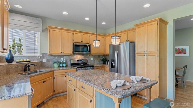 4422 NE 2nd Ln, Renton, WA 98059 - kitchen featuring stainless steel appliances, light brown cabinets, light wood-style flooring, a center island, and recessed lighting