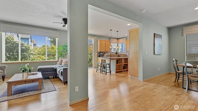 4422 NE 2nd Ln, Renton, WA 98059 - living room with a ceiling fan, light wood finished floors, and recessed lighting