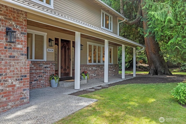 8606 184th St SW, Edmonds, WA 98026 - property entrance featuring brick siding, covered porch, and a lawn