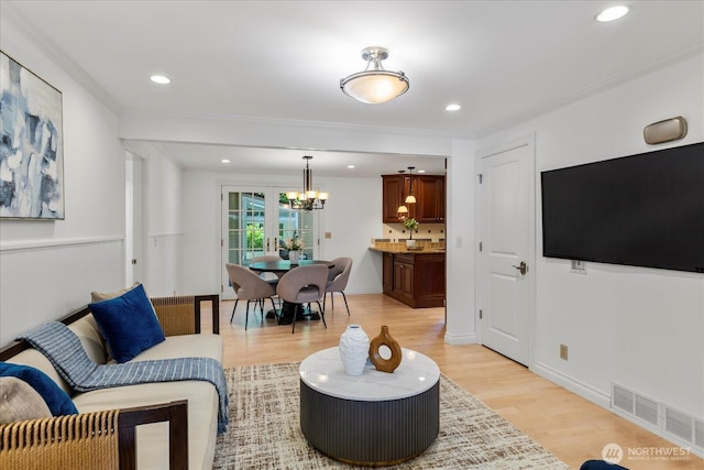 8606 184th St SW, Edmonds, WA 98026 - living area with a chandelier, light wood-style flooring, recessed lighting, and crown molding