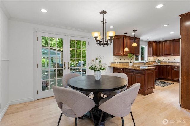 8606 184th St SW, Edmonds, WA 98026 - dining area with light wood-style floors, healthy amount of natural light, french doors, recessed lighting, and a chandelier