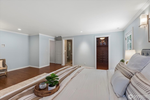 8606 184th St SW, Edmonds, WA 98026 - bedroom featuring wood finished floors, crown molding, recessed lighting, a spacious closet, and a closet