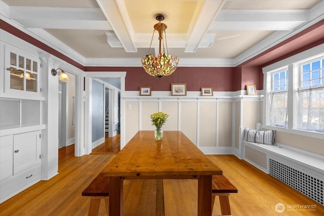 751 S 40th St, Tacoma, WA 98418 - dining area with light wood-type flooring, radiator heating unit, beamed ceiling, and a chandelier