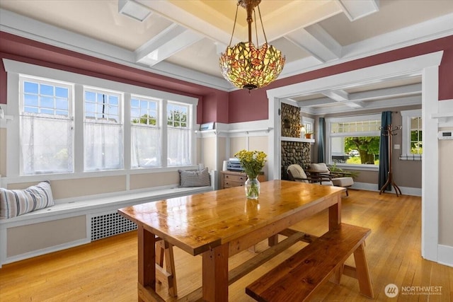 751 S 40th St, Tacoma, WA 98418 - dining room with coffered ceiling, light wood-style floors, healthy amount of natural light, beamed ceiling, and a stone fireplace