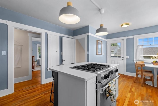 751 S 40th St, Tacoma, WA 98418 - kitchen featuring high end range, light wood finished floors, and plenty of natural light