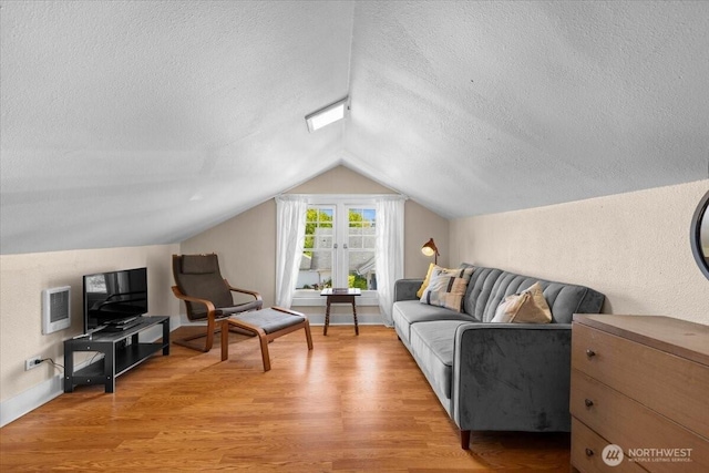 751 S 40th St, Tacoma, WA 98418 - living room featuring a textured ceiling, wood finished floors, and lofted ceiling