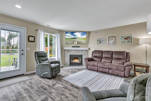 10125 232nd Ave E, Buckley, WA 98321 - living room featuring wood finished floors, a fireplace, and recessed lighting