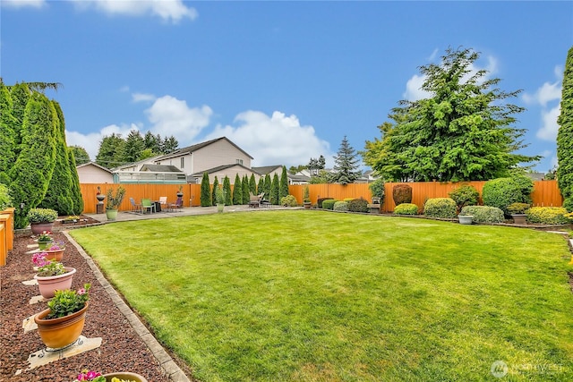 10125 232nd Ave E, Buckley, WA 98321 - fenced backyard featuring a patio
