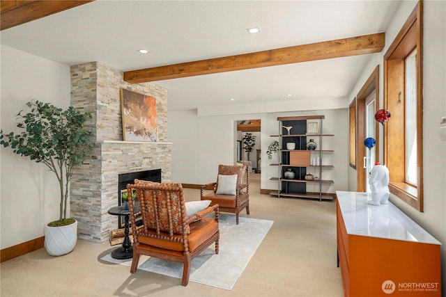 13710 41st Ave NE, Seattle, WA 98125 - living room featuring light wood-style flooring, beam ceiling, a stone fireplace, and recessed lighting