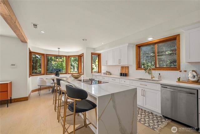13710 41st Ave NE, Seattle, WA 98125 - kitchen featuring dishwasher, black electric stovetop, decorative backsplash, white cabinetry, and recessed lighting
